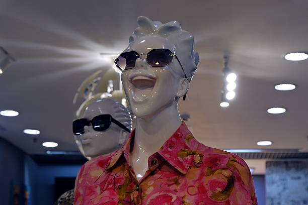 Russia Saint Petersburg July 26 2025. Smiling mannequin with glasses in a shopping mall Brightly and contrastingly made mannequins attract the attention of buyers.