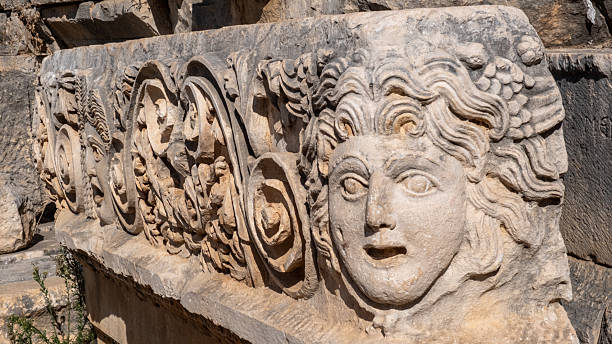 A close-up view of ancient relief carvings in Myra, Antalya, Turkey, showcasing detailed stone figures and classical Lycian–Roman artistry. Ideal for history, archaeology, and cultural content.