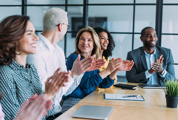 istock Businesspeople applauding during a seminar in conference hall. 2247406528