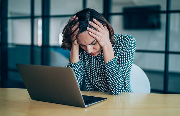 istock Overworked young businesswoman in the office. 2247406559