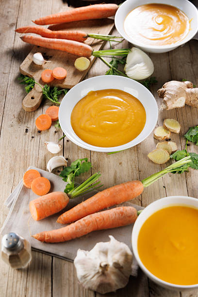 istock vegetable soup in bowl with ingredients on wooden board 2247408045