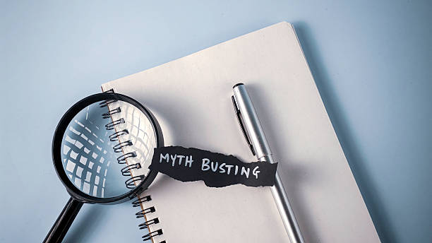 istock Myth Busting and Truth Seeking: Magnifying Glass, Notebook, and Text for Fact-Checking and Debunking Misinformation 2247411429