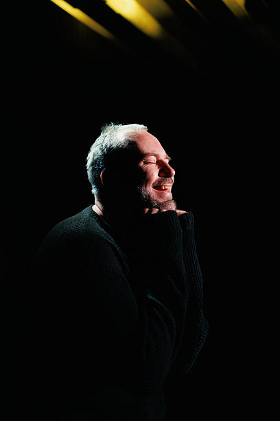 istock Cheerful performer in sweatshirt playing on theater scene 2247411737