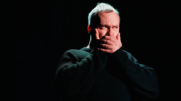 istock Performer covering mouth on theater scene 2247411769