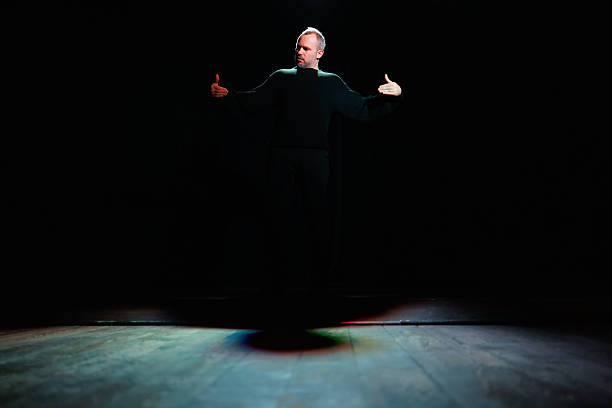 istock Full length of actor performing on scene with shadow 2247412038