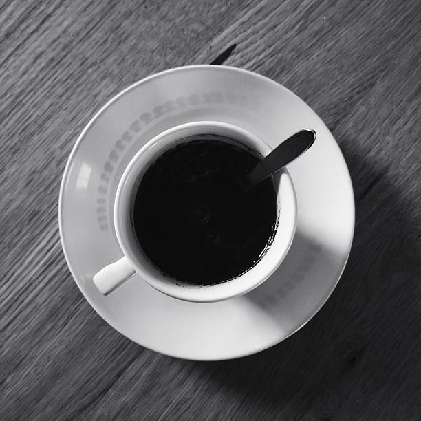 istock Cup of Coffee on Wooden Table 2247416794