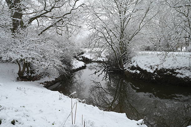 istock River Mole in Horley Surrey during a cold cold snowy winter in the UK. 2247420056