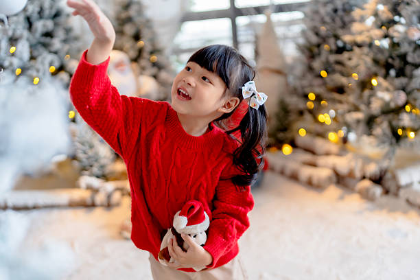 istock Happy kid celebrating Christmas season 2247420211