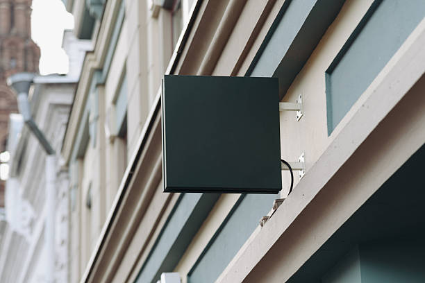 istock empty signboard attached to wall of building, mockup, copy space 2247420508