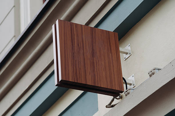empty signboard attached to wall of building, mockup, copy space