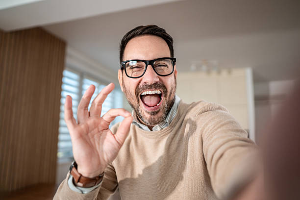 istock Happy man making ok sign during video call, selfie 2247420637