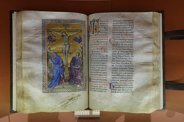 istock Illuminated manuscript with Crucifixion scene, Virgin Mary, Saint John, and Latin script, from San Marco Monastery Library, Florence, Italy, early Renaissance. 2247423457