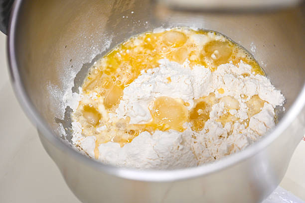istock Flour and Egg Mixture in a Mixing Bowl for Baking Preparation 2247424452