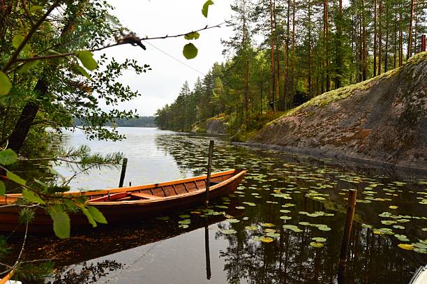 istock Wood boat on a lake 2247425760