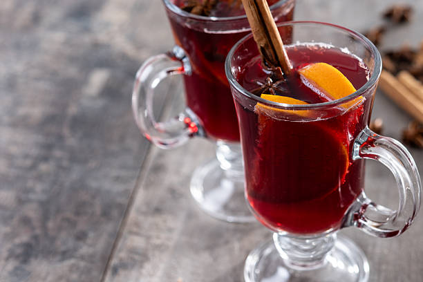 istock Mulled Wine with Orange and Cinnamon Sticks and Christmas decoration 2247427256