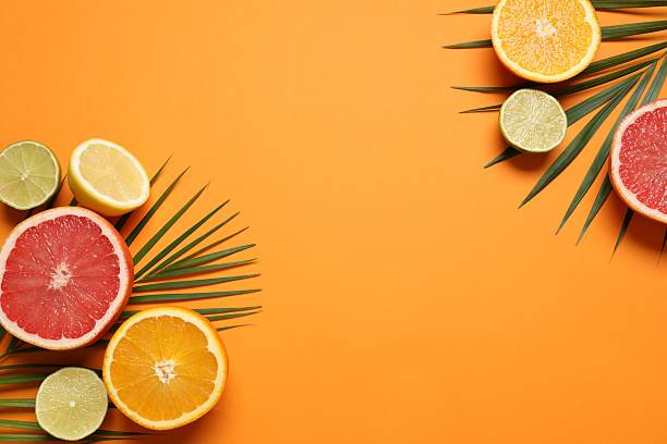 istock Fruit background. Colorful fresh fruit on a table. Orange, lime, lemon, grapefruit. Flat lay, top view, copy space. 2247427591