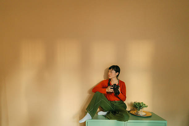 istock Female photographer in her photo studio 2247427904