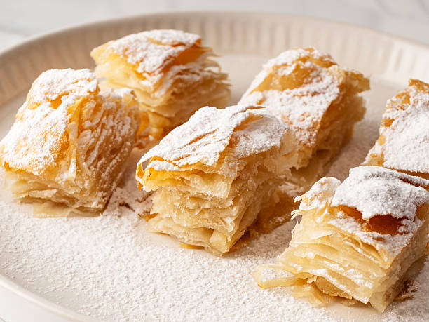 istock Kurdish Pastry with caster sugar / Kurt Boregi. Kurt Boregi breakfast kurdish pastry is traditional turkish borek with powdered caster sugar. 2247427913