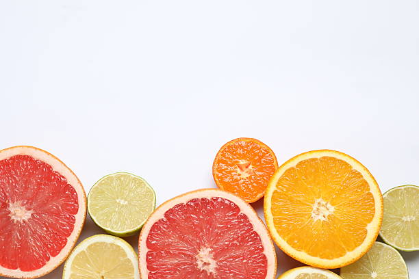 istock Flat lay with different cut citrus fruits on white background 2247431218