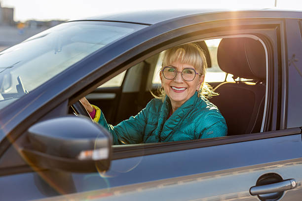 istock Mature female driver smiling behind the wheel 2247432309