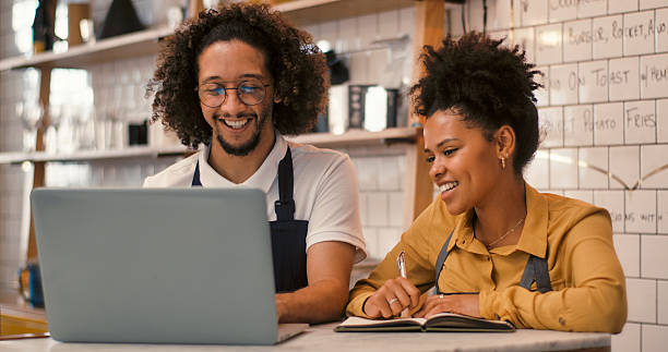 istock Footage of a young man and woman using a laptop . 2247433042