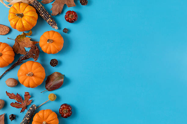 istock Autumnal Background with Pumpkins and Gift Boxes 2247433512