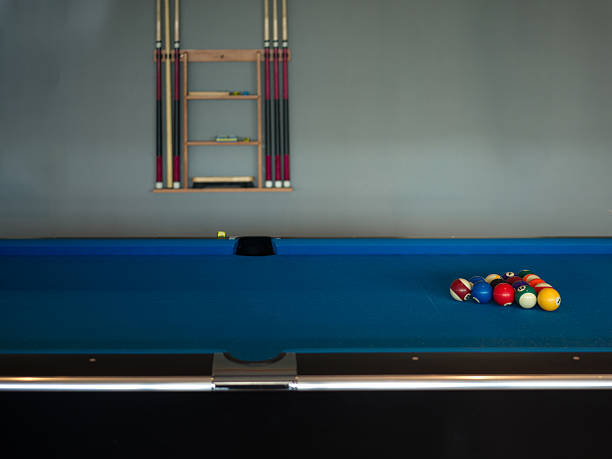 istock A Billiard Table with Colorful Balls and Cue Rack in a Classic Game Room 2247433713