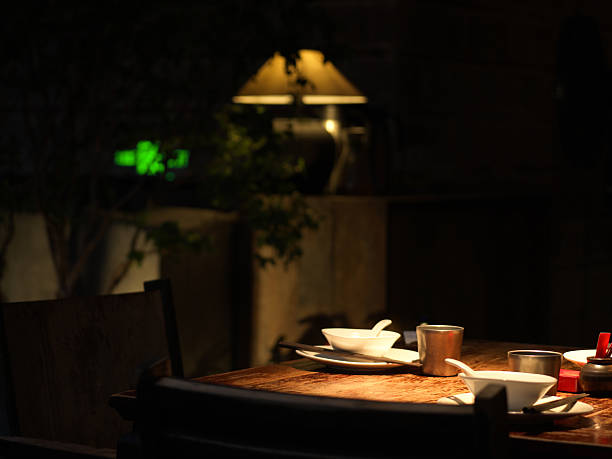A Quiet Table in a Dimly Lit Restaurant with Soft Lighting and Minimalist Decor