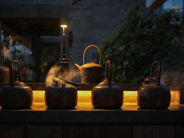 Traditional Teapots Glowing Under Warm Night Lighting