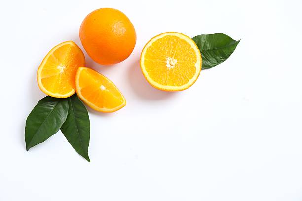 istock Exotic composition of ripe oranges with green leaves on white background 2247434046