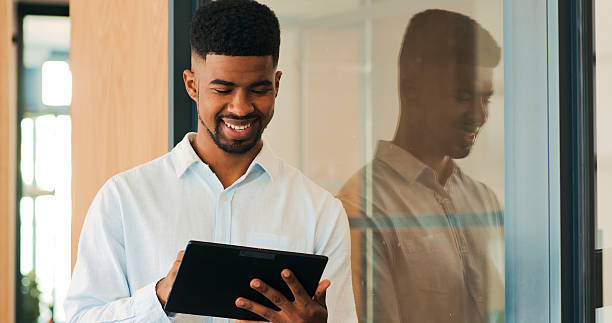 istock Business, smile and black man with a tablet. 2247435404