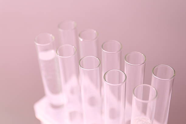 istock Minimal scene with some glass test tubes on pink background. Empty area for product display, copy space 2247435465