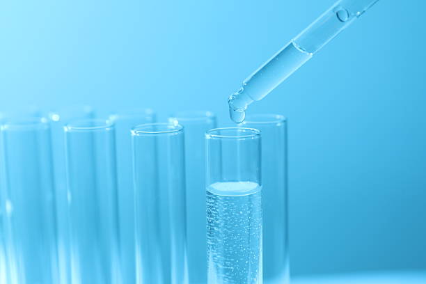 istock Pipette adding fluid to one of several test tubes 2247435506