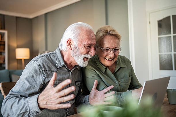 istock Senior couple enjoying video call connection at home 2247437727