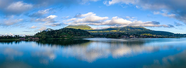 istock Tranquil Lake Batur Panorama with Village and Clouds Reflected 2247438614