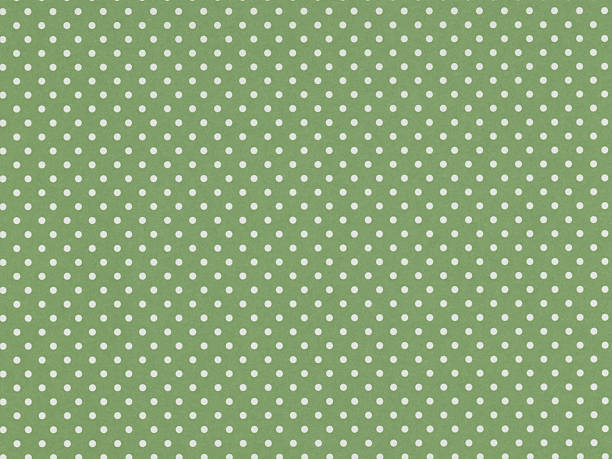 istock Green paper with white polka dots 2247442764