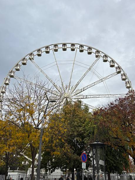 A striking view of Budapest’s Ferris wheel in the city center. The illuminated attraction offers panoramic views of the skyline and the Danube, creating a fun and iconic experience for tourists and locals alike.