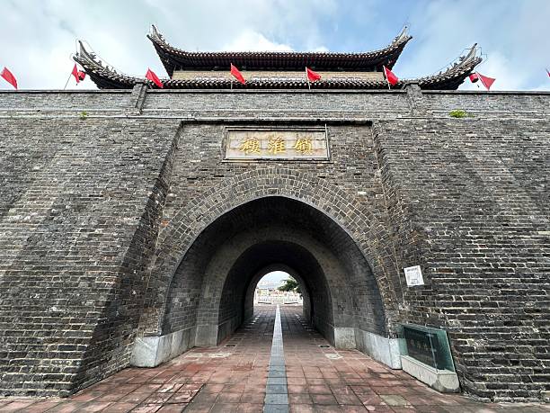 istock Zhenhuai Tower (Town Huai Lou) with arched gate and red flags, Huai'an, Jiangsu, China 2247452414
