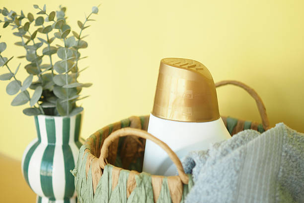 istock Decorative basket with cleaning supplies in bright setting 2247452628