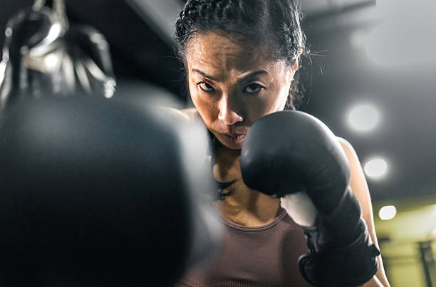 istock Girl power, Japanese athlete practicing boxing 2247453850