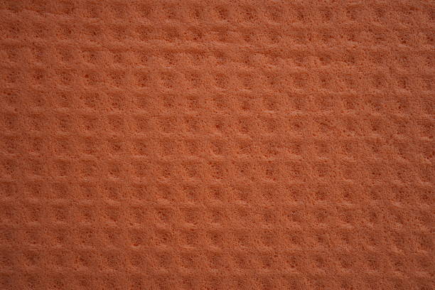 orange sponge texture close up, pink abstract sponge texture as background photo on top