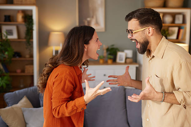 istock Angry couple yelling having relationship conflict at home 2247457754