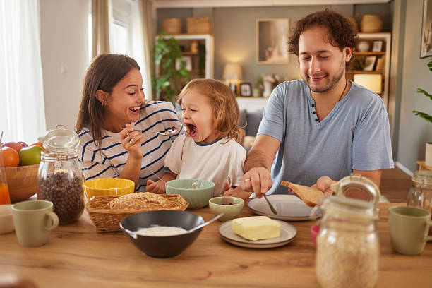 istock Family enjoying breakfast together at home kitchen table 2247458197