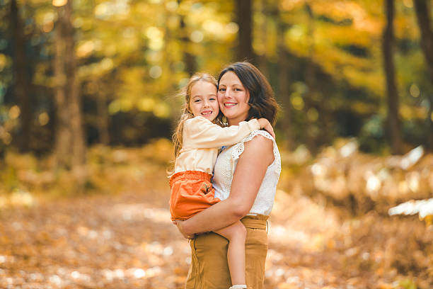 istock Mature mother with daughter on a walk in autumn forest. 2247458358