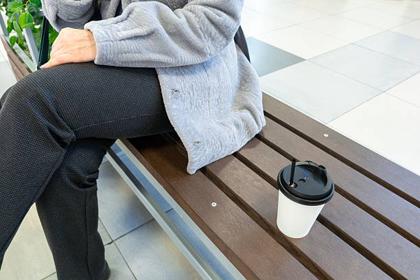 istock Relaxing on a wooden bench with a warm drink during a calm afternoon in a bright, modern space 2247458646