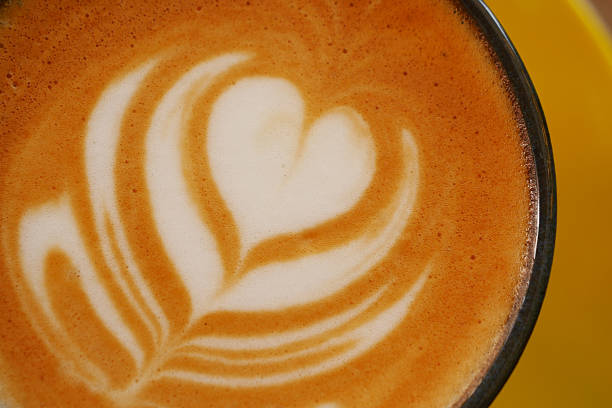 Latte art with heart design in a coffee cup,
