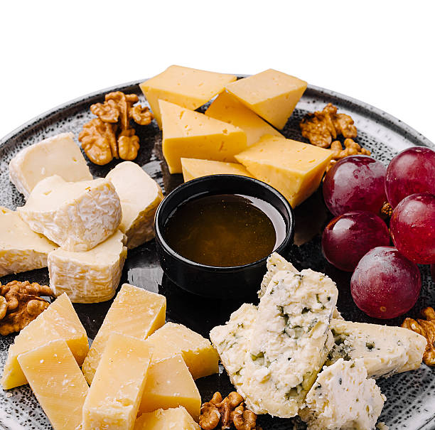 istock Delicious cheese platter with fresh grapes and walnuts for gatherings or parties 2247459466
