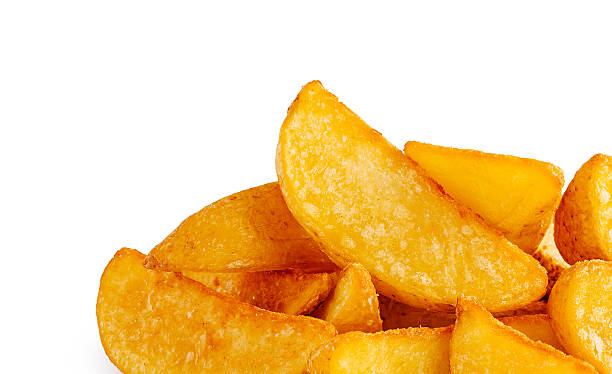 Golden potato wedges served on a white background ready for tasting