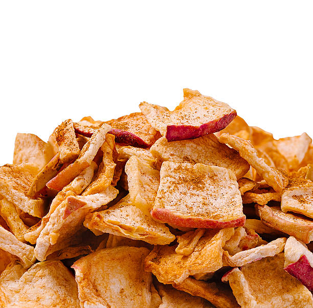 istock Crispy apple chips piled high with a sprinkle of cinnamon for flavor 2247459681