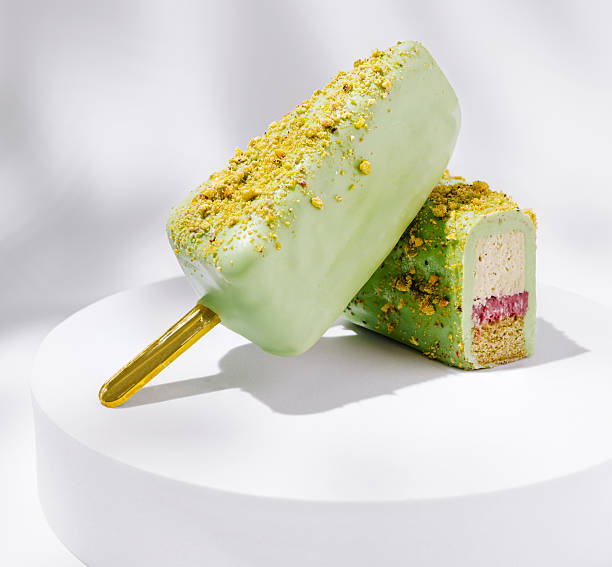 Delicious frozen dessert with pistachio and berry layers on display
